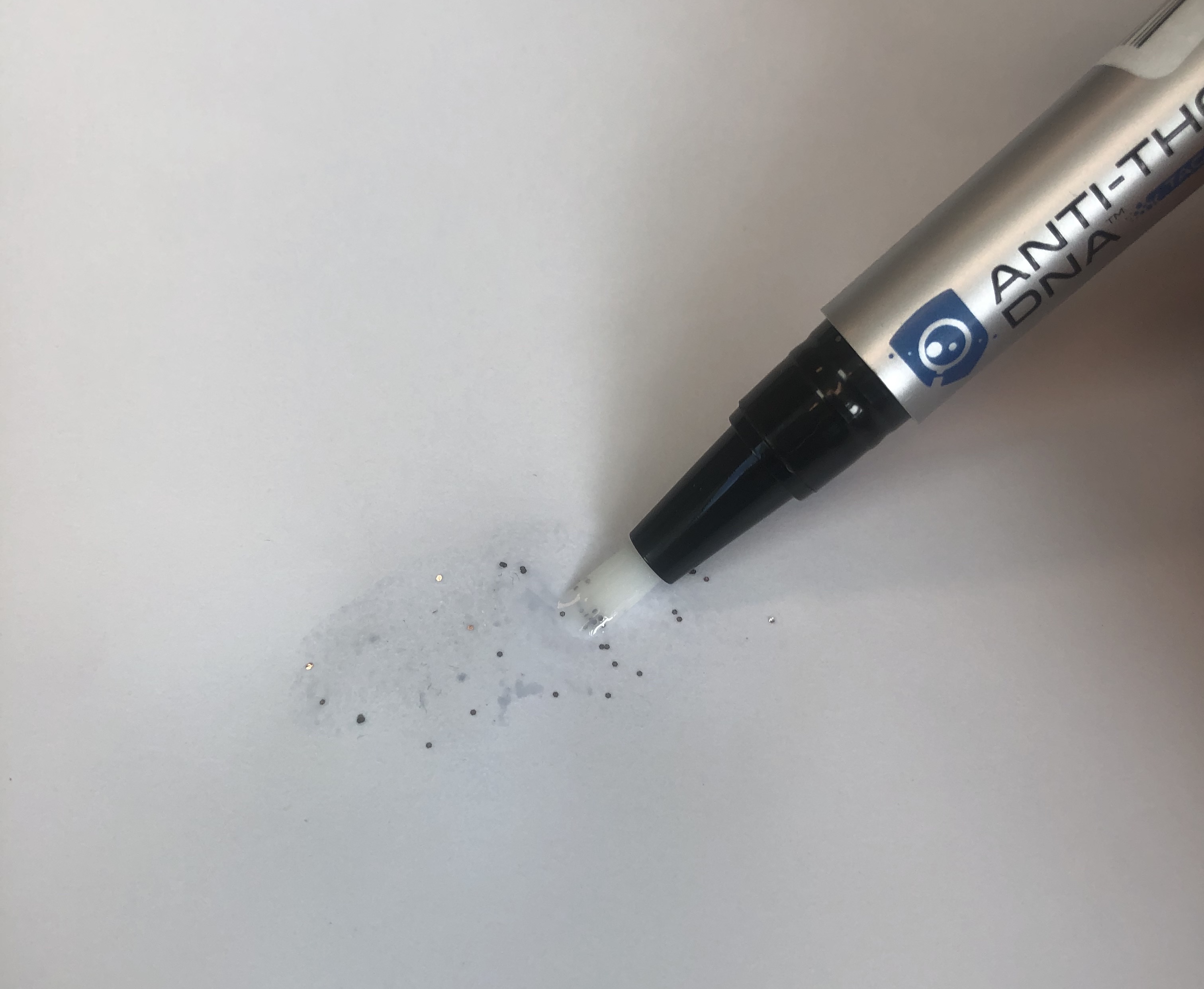 Microdot applicator wand brushing dots onto a surface